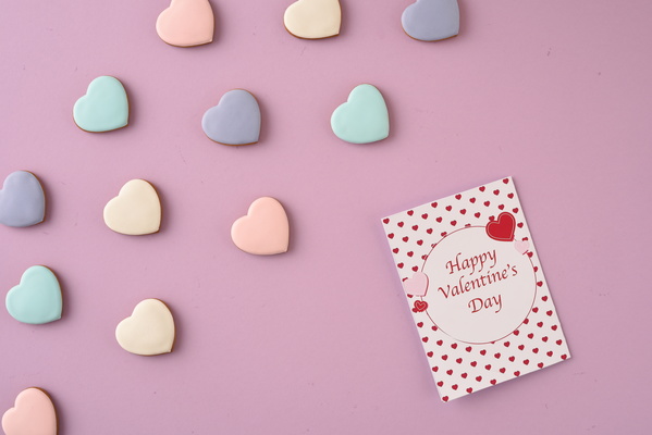 Valentine Card and Some Multicolored Heart-Shaped Cookies